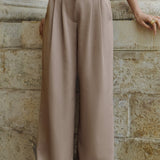 Löngad püksid voldikutega pruunis